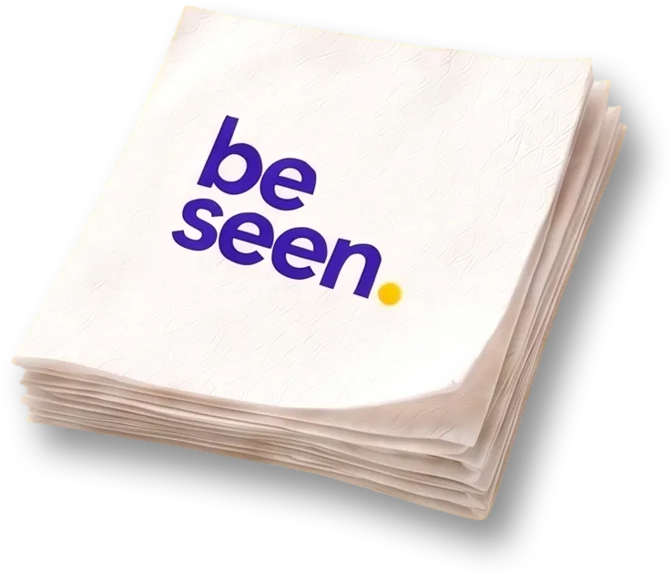 Be Seen branded napkin, folded on a table